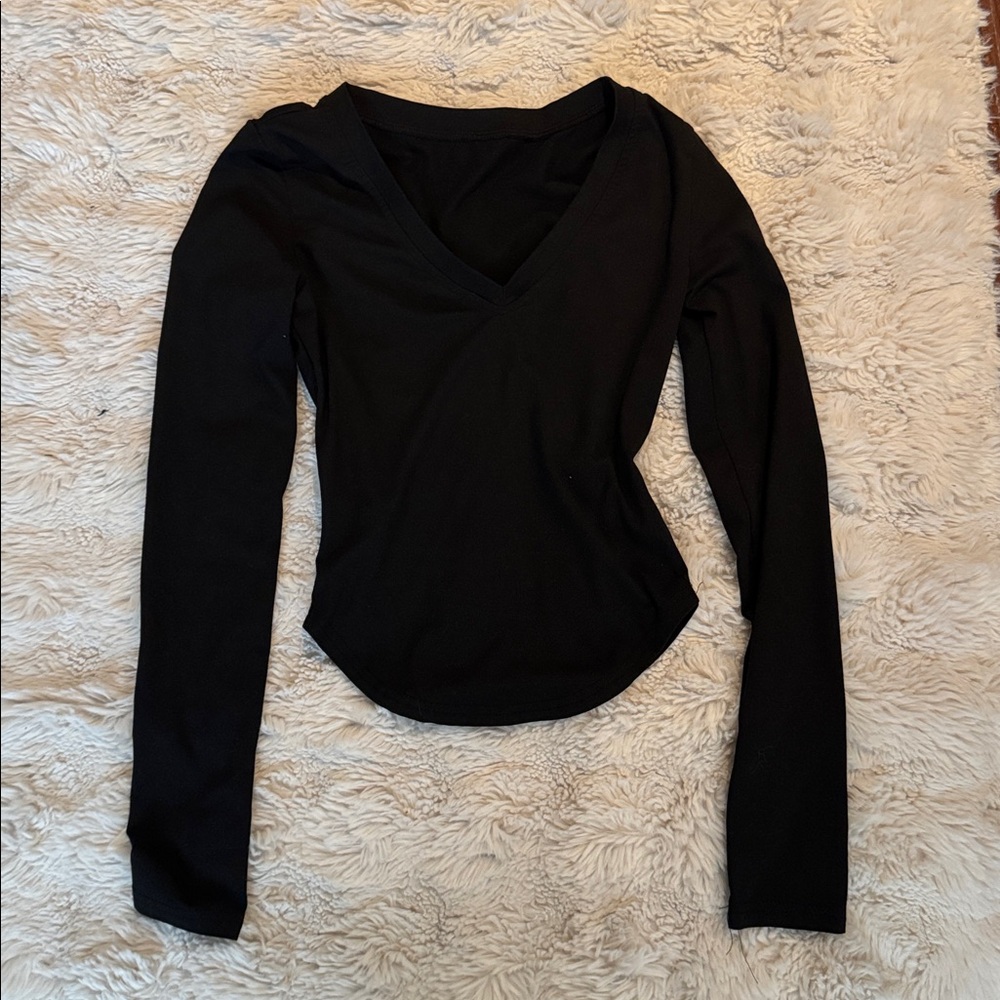 Elegant Black V-Neck Women's Top with Cropped Sides